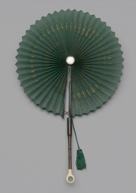 Folding “parasol” or cockade fan of green cotton with mirror. 1870-1879. Museum of the City of New York. 76.69.17. Sweet Sixteen Outfits, Purple Bell Flowers, Chinese Fans, Chinese Fan, Folding Hand Fan, Circular Mirror, Vintage Fans, Hand Fans, Japanese American