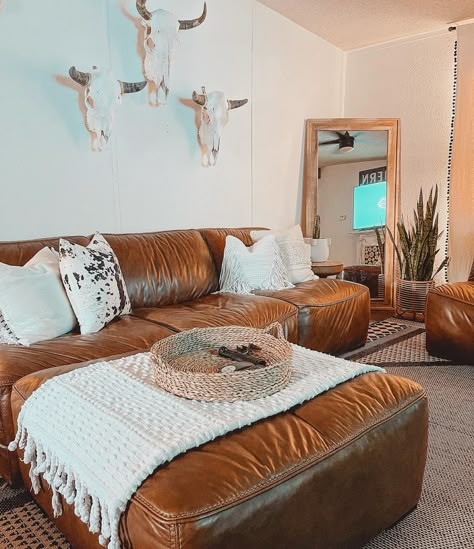 I’m kinda in my minimalist mindset right now as I clean and move the house around 😂 feel like I need to get rid of a lot but maybe the… | Instagram Orange Western Living Room, Western Living Rooms Apartment, Boho Country House Decor, Living Room Decor Western Boho, Rustic Country Apartment Decor, Boho Cowboy Home Decor, Boho Cowgirl Home Decor, Western Tiny Home Decor, Western Lounge Room