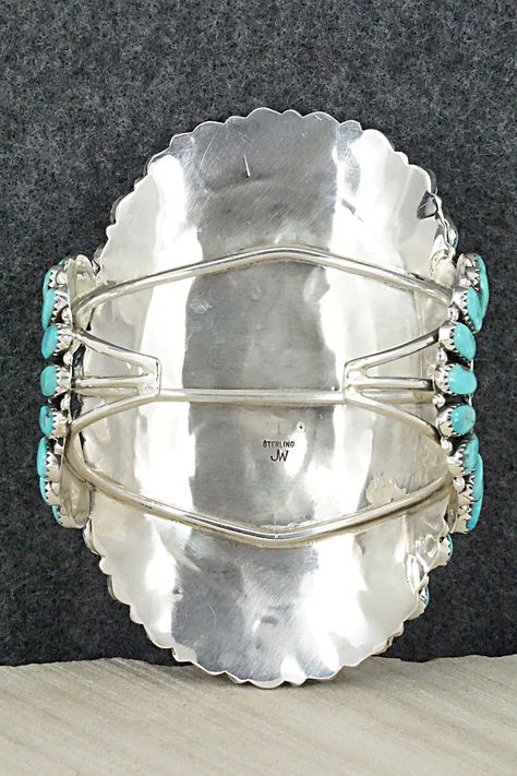 This stunning Kingman turquoise and sterling silver bracelet was expertly made by Navajo silversmith Jesse Williams. The inside is signed JW and stamped sterling.Size: 5 1/2" (will fit up to a 6 5/8" wrist)Gap: 1 1/8"Length: 3 3/4"Free shipping on all orders! We ship with USPS and always include tracking. All orders ship within a day of payment.Returns are accepted up to 30 days after you receive your order. Just send us a message. Our shop offers cash back or store credit. The item must be retu Southwestern Hallmarked Sterling Silver Jewelry, Southwestern Turquoise Nickel-free Beaded Bracelets, Southwestern Style Turquoise Hand-strung Jewelry, Jesse Williams, Southwestern Style Blue Turquoise Nickel-free Necklace, One-of-a-kind Southwestern Turquoise Jewelry, Kingman Turquoise, Vintage Turquoise, Blue Jewelry