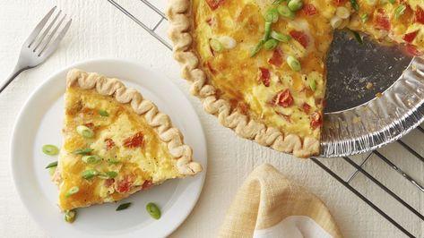 Say goodbye to boring quiches and hello to this elegant number loaded up with all the fixings! A frozen deep-dish pie crust makes the base of this bake a breeze, and the custard-like egg filling is loaded with fresh tomatoes, green onions, crisp bacon and melty cheeses for tons of flavor in every bite. Whether you serve this for breakfast, brunch or lunch, it’s guaranteed to go fast. Ham And Swiss Quiche, Bacon Quiche Recipe, Gluten Free Ham, Ham And Cheese Quiche, Bacon Quiche, Cheese Quiche, Bacon Tomato, Quiche Recipes, Gluten Free Breakfasts