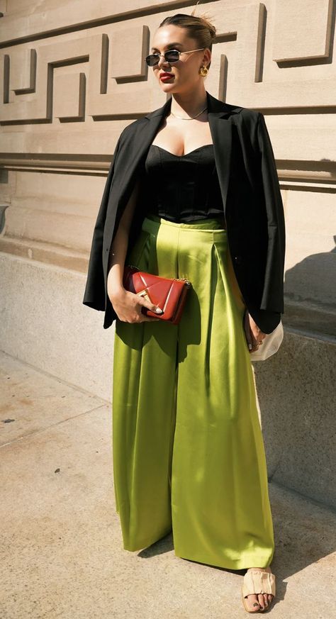 White person looking off to the side wearing a black jacket, black shirt, and green silk pants with a red hand bag. Green Silk Pants Outfit, Green Silk Pants, Silk Pants Outfit, Green Pants Outfit, Late Summer Outfits, New York Fashion Week Street Style, The Best Street Style, Summer Outfit Inspiration, Best Street Style