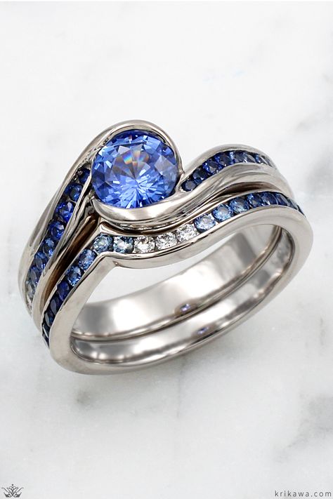 This Carved Wave Engagement Ring is set with a blue sapphire and is paired with a Diamond Channel Contoured band. Contour Band, Wave Ring, Bridal Set, Blue Diamond, Bridal Sets, Beautiful Things, Beach Wedding, Blue Sapphire, Band Rings