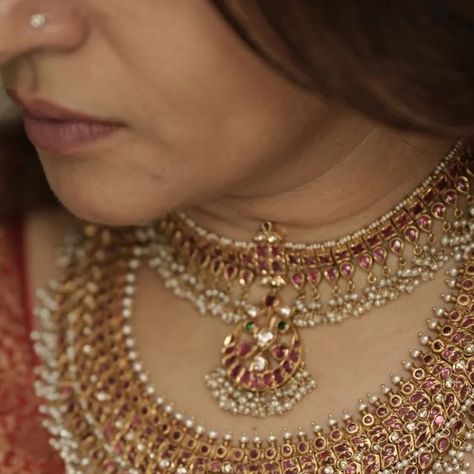 Gold & Antique Jewellery on Instagram: "Two masterpieces designed to make your special day truly unforgettable. Each element of the necklace is carefully designed to enhance your bridal glow, featuring beautiful rubies, diamonds, emeralds, pearls and shimmering gold that reflect timeless beauty. 

To own these gorgeous 22k Gold necklaces call or WhatsApp at +919986001216.

With over 50 years of combined design and jewelry expertise from Co-founders @ashwini.oza and @chetgr, each in-house creation at @arnav_jewellery, whether in SILVER or GOLD, guarantees you’re obtaining a true masterpiece.

#webelieveinhandmade #jewelleryrevivalist #jewellery #jewellerydesigner #goldjewellery  #handcraftedjewellery #arnavjewellery  #ashwinioza #sbao #22kgold #necklace #sustainablefashion #jewelleryofindia Arnav Jewellery, Kanti Necklace Designs, Gold Antique Jewellery, 22k Gold Necklace, Temple Jewelry Necklace, Neck Pieces Jewelry, Temple Jewelry, Antique Bridal Jewelry, Dance Jewelry