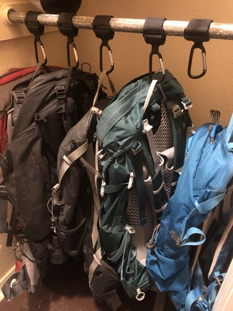 Use stroller keepers with heavy Velcro and carabiner clips to make backpack storage neat and tidy in a closet. No need for hooks that are stationary, or hangers that will break. Backpack Storage Bedroom, Hiking Gear Closet, Camping Closet Organization, Backpacking Storage Ideas, Hiking Gear Organization Ideas, Rucksack Storage Ideas, Hiking Closet Organization, Backpacks Storage Ideas, Creative Backpack Storage