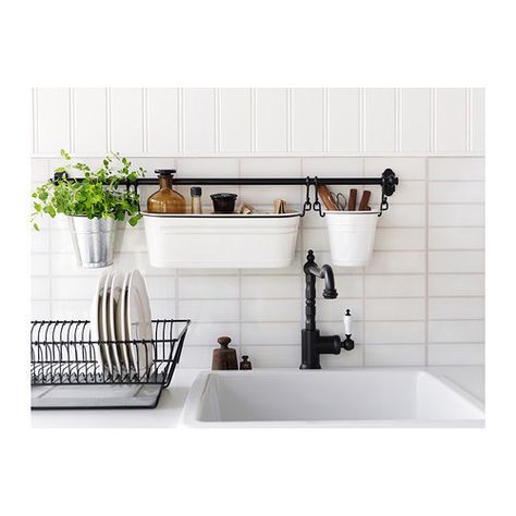 Make the most of a tiny counter with a wall-mounted sink caddy. | 17 Ways To Squeeze A Little Extra Storage Out Of A Tiny Kitchen Fintorp Ikea, Above The Kitchen Sink, Organiser Cucina, Koti Diy, Clutter Free Kitchen, Apartment Needs, Interior Design Minimalist, Small Apartment Kitchen, Small Kitchen Storage