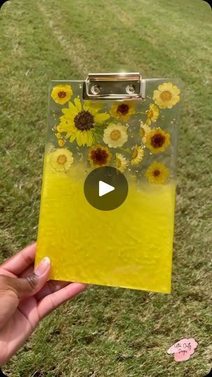 183 reactions · 8 comments | 🌟 We’re loving this yellow-themed small clipboard by @imjessultracrafty_! 🌻 

Watch the satisfying moment halfway through the video where she peels off the protective layer, keeping the other side safe from drips. 

The gold hardware is a stunning addition that elevates the piece even more!

#teachergifts #teacherstyle #personalizedclipboard #resinclipboard #teacherappreciation #sunflower #yellowflowers #DIYProjects #Alumilite #epoxyresin #epoxyart #resinart #diyepoxyart #resinpour #Alumination #formakersbymakers #epoxypeojects #diy | Alumilite | alumiliteco · Original audio Resin Pour, Diy Epoxy, Teacher Style, Clipboard, The Gold, Teacher Appreciation, The Other Side, Resin Art, Yellow Flowers