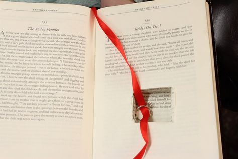 The ring was inside the book, hanging by a red thread with a bookmark on the story, “Brides on Trial.” | This Couple’s Bookstore Proposal Is Every Book Lover's Dream Bookstore Proposal, Book Hanging, Buzzfeed Articles, Lover Wedding, Wedding Makeup For Brunettes, Book Proposal, Wedding Proposals, Red Thread, Marriage Proposals