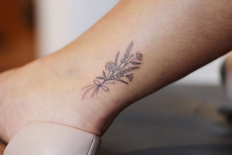 Floral bouquet tattoo Script Floral Tattoo, Birth Flower Bouquet Tattoo Ankle, Dried Flower Bouquet Tattoo, Birthday Flowers Bouquet Tattoo, Ankle Flower Bouquet Tattoo, Flower Bouquet Tattoo Ribs, Wild Flower Bouquet Tattoo, Family Birth Flower Bouquet Tattoo, Wildflower Bouquet Tattoo