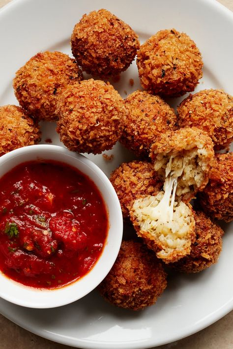 Arancini Recipe - NYT Cooking Risotto Balls, Cleaning Baking Sheets, Arancini Recipe, Parmesan Risotto, Nyt Cooking, Rice Balls, Fried Food, Italian Seasoning, Small Plates