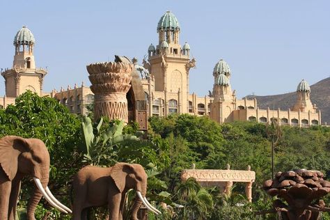 South African palace surrounded by trees and elephants African Palace, Sun City South Africa, Sun City Resort, Africa Do Sul, Run Dmc, South Africa Travel, Sun City, Ray Charles, Keith Richards