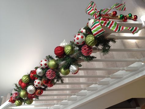 Use straight across the bookcase with bells falling on either side. Stairs Garland, Christmas Garland Staircase, Staircase Christmas, Christmas Banister, Christmas Stairs Decorations, Staircase Decor Ideas, Christmas Staircase Decor, Elf Christmas Decorations, Christmas Stairs