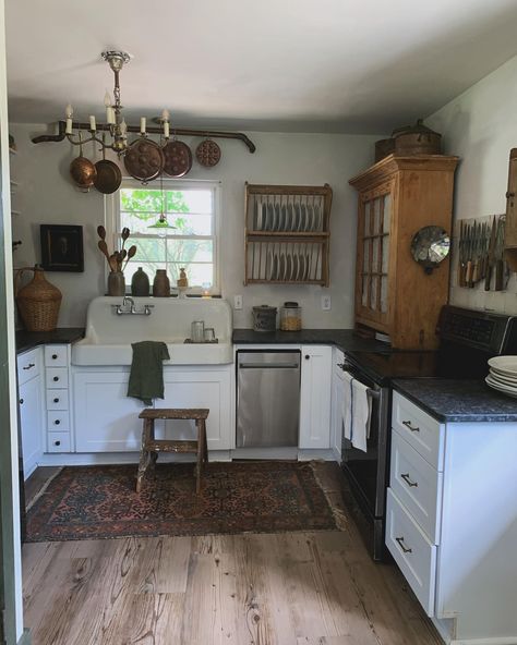 Kitchen tour : here’s our full kitchen & all the views. 🤎 Our chandelier won’t be staying there, for some reason they didn’t put the main lighting in the middle of the room lol but eventually it’ll be canned lights with beams hung. . . . . . . . . . . . . #smallkitchen #kitcheninspiration #kitchendesign #kitchendecor #myflippingvintage #cottagecoreaesthetic #vintagefarmhousestyle #cottagehome #fleamarkethomeandliving #fleamarketdecor #cottagedecor #primitivedecor #vintagefarmhousefinds #v... 1800s Kitchen, Old Farmhouse Remodel, 1900s Kitchen, Canned Lights, 1800s House, 1800s Home, Antique Farmhouse Decor, Kitchen View, Homestead House