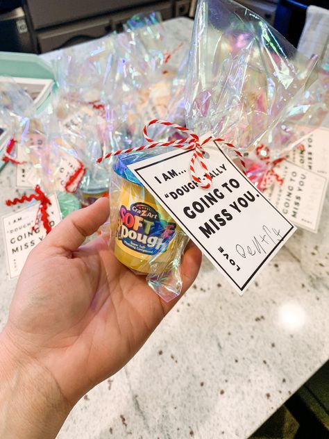 Gift idea for classmates when kids move away. I’m “dough”-tally going to miss you. Simple and cheap! Bags: $1 + bulk size play dough: $10 (Walmart) + cute ribbon: $5 (from Michaels) + signs: I created in photoshop! Feel free to message me if you want the template! Goodbye Gift For Preschool Students, Gifts For Students From Student Teacher Goodbye, Goodie Bags For Students, Student Teacher Gifts Goodbye For Kids, Student Teaching Goodbye Gifts Kids, Gift Ideas For Classmates, Gifts For Classmates, Teaching Gifts, Gift For Classmates