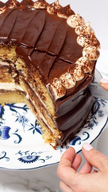 Maddie & Jules on Instagram: "Tiramisu cake starts with vanilla bean cake that then gets layered with marscapone filling, espresso soak, and espresso chocolate ganache. It is a tiramisu lovers ideal cake!   Full tiramisu cake recipe linked in bio or visit https://kitchen-by-the-sea.com/tiramisu-cake/  Vanilla Cake (Makes 3 9” rounds) 3 ¾ cups cake flour 445 grams 2 ½ cups granulated sugar 500 g 1 ½ teaspoon baking soda 7 ml 1 tablespoon diamond kosher salt 15 ml 2 tablespoons vanilla bean paste or 2 teaspoons vanilla extract, 30 ml ½ teaspoon almond extract 3 ml 1 ½ cup buttermilk 360 ml 3 eggs 1 ½ cup avocado oil 360 ml 1/2 cup melted salted butter 113 g ¼ cup hot water 60 ml Espresso Chocolate Ganache: 8 ounces dark chocolate 70% cocoa 6 tablespoons butter 85 g 2 teaspoons vanilla 10 ml Tiramisu Chocolate Cake, Tiramisu Wedding Cake, Planet Chocolate, Cake Ganache, Tiramisu Cake Recipe, Vanilla Bean Cake, Almond Coffee Cake, Chocolate Tiramisu, Vanilla Bean Cakes