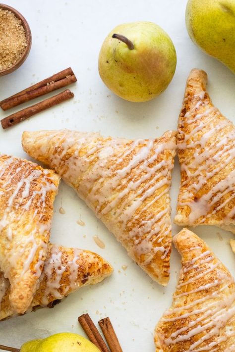 golden brown baked and glazed pear turnovers Pear Turnovers Puff Pastries, Pear Danish, Pear Pastry, Pear Turnovers, Pear Puff Pastry, Cooked Pears, Fall Pastries, Carmelized Pears, Glazed Pears