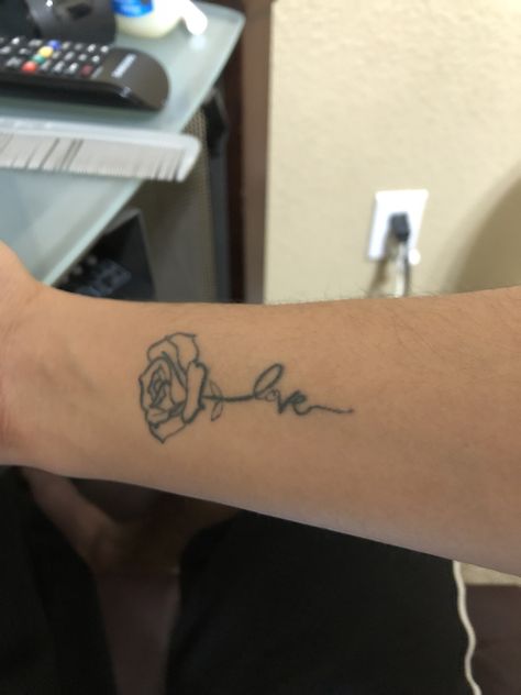 A rose with the stem saying “love” in cursive tattoo. Love In Cursive Tattoo, Love You More Tattoo, Tattoo Cursive, Font Tato, Cursive Tattoo, Love In Cursive, Tattoo Fonts Cursive, Cursive Tattoos, Love Articles