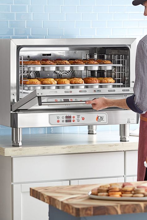 Person taking muffins out of a steam injection oven. Best Kitchen Oven, Rotisserie Oven Kitchen, Small Commercial Oven, Industrial Baking Oven, Home Kitchen With Commercial Appliances, Tiny House Kitchen Countertops, Pro Chef Kitchen, Garage Oven, Falcon Oven In Kitchen