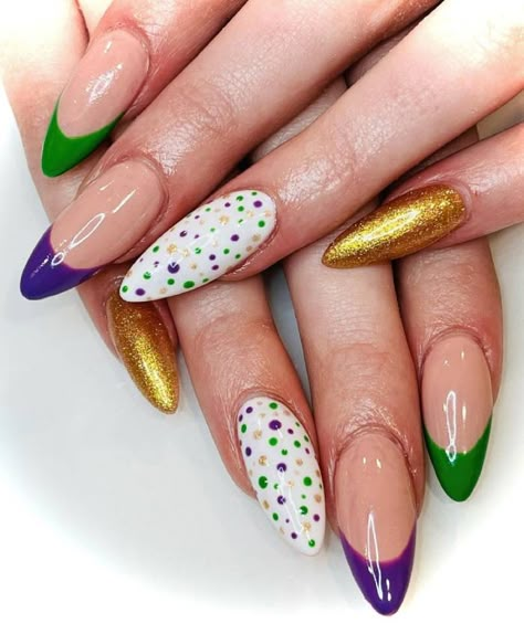 These fun Mardi Gras nails will help you celebrate the holiday in style, with purple, green, and gold colors, fun designs, 3D art, and more. #mardigras #naildesigns #nailart Mardi Gras French Tip Nails, Mardi Gras And Valentines Day Nails, Cute Mardi Gras Nails, New Orleans Inspired Nails, Nola Nails New Orleans, Mardi Gras Valentine Nails, Purple Green Gold Nails, Mardi Gras Nails Dip, Mardi Gras Gel Nails Ideas