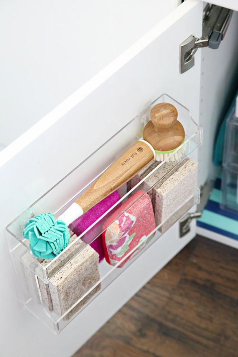 Hang a spice rack on the inside of the cabinets under your sink to hold extra sponges and scrub brushes. Organizing Under Kitchen Sink, Bathroom Organization Ideas Under Sink, Organize Under Kitchen Sink, Under The Kitchen Sink Organization, Kitchen Sink Remodel, Under The Sink Storage, Under The Sink Organization, Under Kitchen Sink, Sink Organization