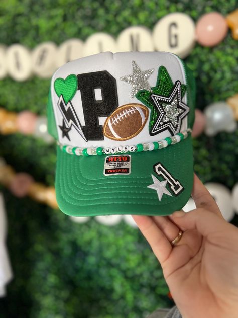 Friday Night Lights hair? Don't care!  Every football mom needs one of our custom trucker hats to wear on Friday nights. I also have different colored footballs, baseballs, softballs, soccer balls, hockey sticks, volleyballs and basketballs!   All our hats are totally customizable, so message us to request custom colors or patches. We can build a custom listing just for you! Football Mom Trucker Hats, Football Accessories Ideas, Football Trucker Hat With Patches, Customizable Green Baseball Cap, Team Mom Football Ideas, Trucker Hats With Patches, High School Spirit, Hat Chain, Football Moms