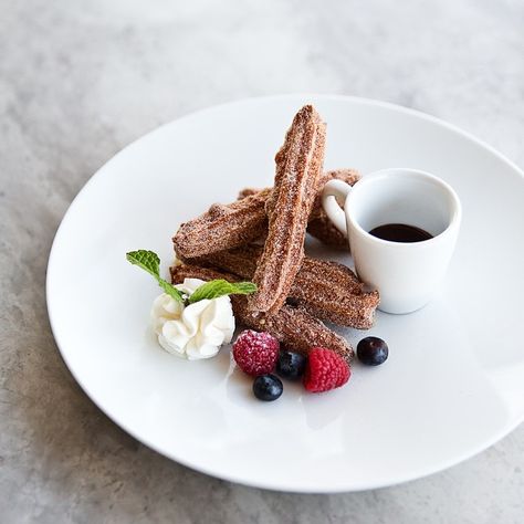 A churro with all our favorite accoutrements: berries, cream and chocolate. Gourmet Desserts Presentation, Fancy Desserts Presentation, Fancy Food Presentation, Chocolate Tarts, Easy Casserole Dishes, Plated Dessert, Dessert Presentation, Dessert Plating, Gourmet Desserts