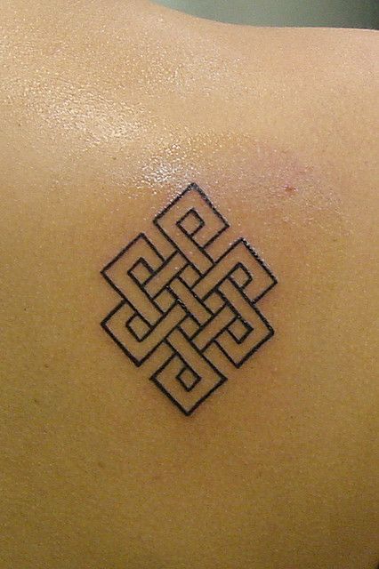 The design is an endless knot, a Buddhist symbol that represents the eternalness of our souls and the never-ending cycle of karma. Karma Symbol Tattoo, Karma Symbol, Karma Tattoo, Endless Knot, Knot Tattoo, Buddhist Symbols, Symbol Tattoo, Symbol Tattoos, Symbolic Tattoos