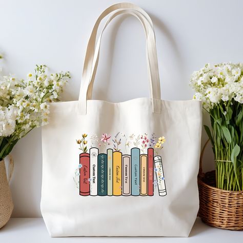 Book Lover Tote Bag, Customizable with your favorite book titles Different colors and sizes are available Check the link below for more details https://www.etsy.com/ca/listing/1725001956/floral-tote-bag-personalized-favorite?ref=listings_manager_grid Tote Bag Diy Pattern, Custom Bookshelf, Books Tote, Canvas Bag Diy, Tote Bag Custom, Floral Tote Bag, Book Tote Bag, Recycle Bag, Diy Tote Bag