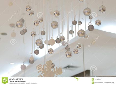 Silver Baubles Hang From Ceiling With Snowflake For Decorate Stock Image - Image of holiday, baubles: 107680383 Hanging Ornaments From Ceiling, Decorate Ceiling, Balloon Centerpieces Diy, Hang From Ceiling, Christmas Present Decoration, Christmas Ceiling Decorations, Holiday Baubles, Floating Ornaments, Silver Baubles