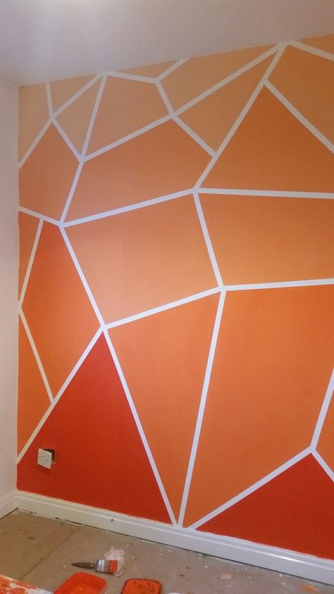 Orange Wall Design Interiors, Geometric Wall Paint Orange, Bedroom Orange Walls, Masking Tape Painting Walls, Tape Painting Wall, Geometric Wall Paint Bedroom, Orange Wall Paint Ideas, Cool Wall Painting Ideas Creative, Colourful Wall Painting