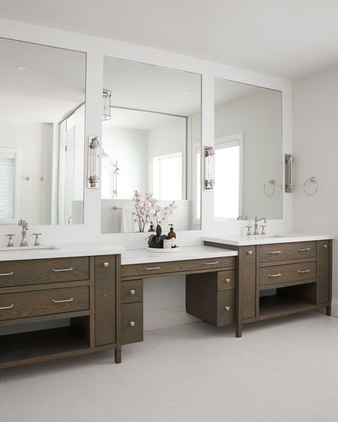 Taking your bathroom selfies to the next level! 📸 With dual vanities and the perfect makeup station, what more could you need? | Designer: @madison_taylor_inc | Visit us at https://www.absolutecabinets.ca/ Two Vanity Bathroom Separate, Double Vanity With Makeup Area Middle, Double Vanity With Makeup Area, Dual Vanity Bathroom Ideas, Large Double Vanity, Bathroom Vanity With Makeup Area, Dual Bathroom, Vanity With Makeup Area, Vanity With Makeup