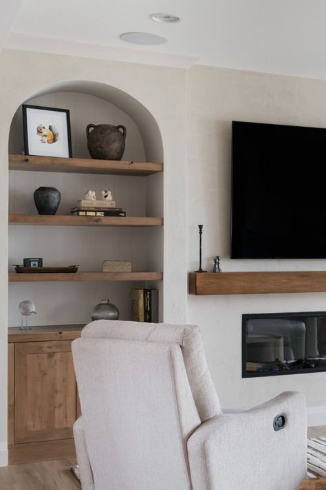 Arch Tv Wall Design, Arched Alcove Ideas, Arch In Home, Arched Built Ins Fireplace, Arched Bookcase Built In, Arched Built Ins Living Room, Fireplace With Built Ins On Both Sides, Arched Alcove, Basement Living Space