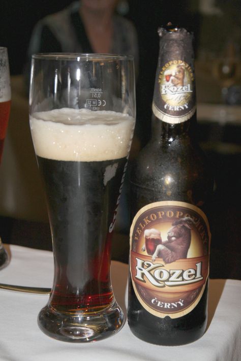 Kozel is a Czech lager produced since 1874.  In that year, Franz Ringhoffer founded a brewery in Velké Popovice, a town 25km (15mi) southeast of Prague. Their symbol is a goat (Kozel means "goat" in Czech).  Emanuel Ringhoffer started to brew in Velke Popovice a strong, dark beer according to local tradition, which was known locally as Kozel. At that time a French painter passed through Velke Popovice and created the emblem for the brewery. Czech Beer, Dark Beer, A Goat, A Town, Prague, Beer Glasses, Goats, Painter, Coasters