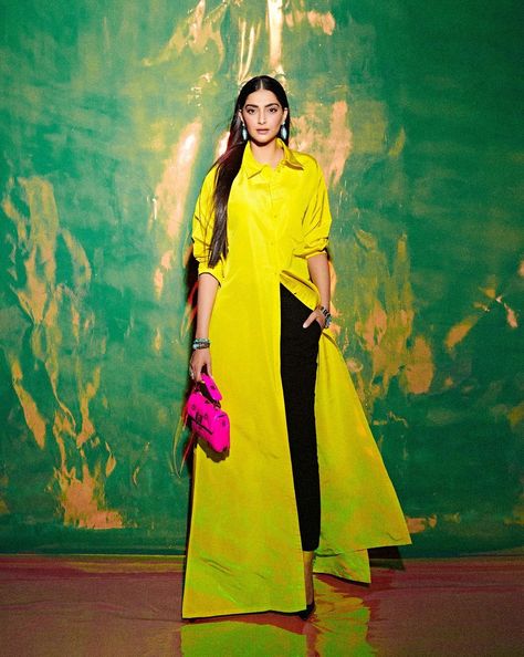 Bollywood actress, Sonam Kapoor is indeed a fashion queen. She is counted amongst some of the most bankable actresses in the industry whose wardrobe collection is a dream for many. From luxurious ensembles and accessories, including bags, shoes, and jewellery, to all other styling elements, Sonam has an array of collections in her wardrobe. Now, recently, as she stunned in a striking yellow shirt dress, she was seen giving tough competition to Hollywood actress, Anna Hathaway.    Sonam K White Pumps Heels, Yellow Shirt Dress, Valentino Shirt, White Pump, Tiny Clothes, Fashion Queen, Beautiful Pakistani Dresses, Yellow Shirt, Celebrity Moms