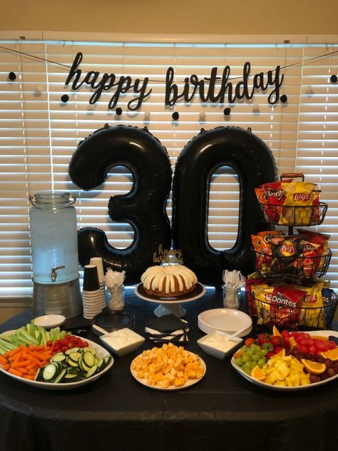 Simple and pretty 30th birthday party snack table and photo back drop Big 30th Birthday Party Ideas, 30th Party Decorations Men, Table Decoration For Men Birthday, Mens 32 Birthday Party Ideas, 30th Birthday Bar Ideas, 30 Man Birthday Party, Cheers To 30 Years Decorations, Simple Party Decorations For Men, Snack Table For Birthday Party