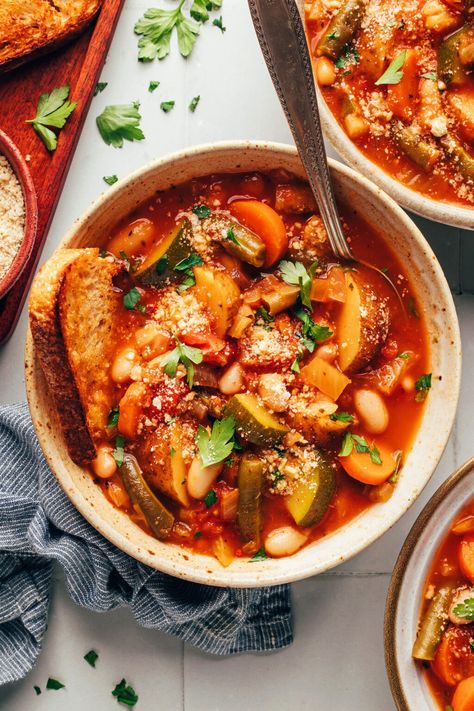 1-pot white bean minestrone packed with veggies and potatoes. A simple, comforting, plant-based meal paired with your favorite bread or croutons! Yummy Vegan Recipes, Squash Soups, Vegetarian Stew, White Bean Recipes, Eggplant Caponata, Cozy Soup, Vegan Parmesan Cheese, Summer Produce, Minimalist Baker