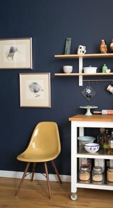 The right color of dark paint can give your home a moody, glamorous look. Tess from Apartment Therapy shares her favorite shades of BEHR Paint for creating the perfect dark wall. This miniature kitchen area uses a coat of Starless Night set against bright white trim and light wooden flooring to create the perfect touch of drama. Kitchen Spotlights, Blue Kitchen Walls, Honey Oak Cabinets, Paint For Kitchen Walls, Painting Oak Cabinets, Rental Kitchen, Oak Kitchen Cabinets, Kitchen Walls, Honey Oak