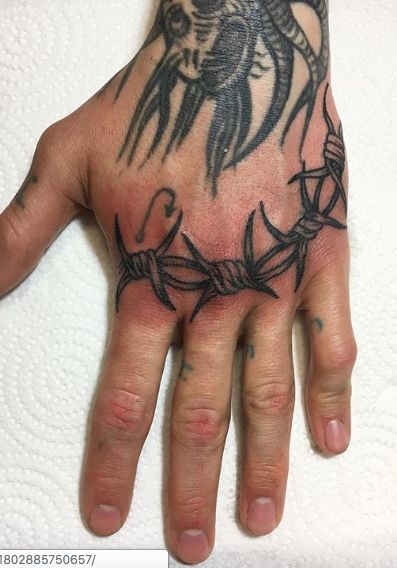 Blackwork barbed wire hand tattoo by Izabella Barbed Wire Knuckle Tattoo, Barbwire Hand Tattoo, Barb Wire Hand Tattoo, Barbed Wire Hand Tattoo, Female Hand Tattoo, Best Tattoos For Men, Barbed Wire Tattoo, Wire Tattoo, Hand Tattoo Designs