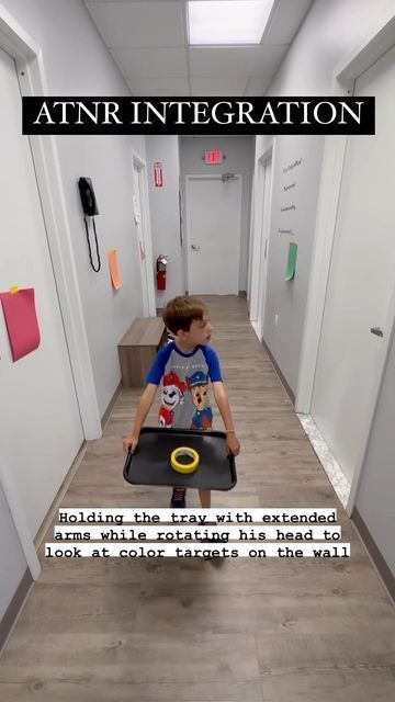 More Than A Gym on Instagram: "Maintaining extended elbows while rotating the head to either side helps to integrate ATNR! Making it a functional task to appropriately cue the child by carrying a tray with extended elbows while turning his head to look at color targets. 𝗪𝐡𝐲 𝐢𝐬 𝐭𝐡𝐢𝐬 𝐢𝐦𝐩𝐨𝐫𝐭𝐚𝐧𝐭? A retained ATNR could affect the following in early childhood:⁣ ❗️bilateral coordination⁣ ❗️visual tracking⁣ ❗️crossing midline⁣ ❗️handwriting⁣ ❗️balance⁣ ❗️sitting posture⁣ ❗️attention and focus⁣ ⁣ Do you have concerns of your child having retained reflexes and is it affecting them in the classroom? Our skilled team of therapists can work with you and your child on reflex integration.⁣ ⁣ #morethanagym #sensorygym #reflex #reflexintegration #atnr #retainedreflexes #primitivereflexes Reflex Integration, Sensory Integration Activities, Pediatric Physical Therapy Activities, Sensory Classroom, Primitive Reflexes, Bilateral Coordination, Visual Tracking, Social Skills For Kids, Pediatric Physical Therapy