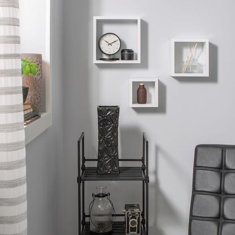 Give your space an instant makeover with this Wood Wall Cube Set of Three. It features a contemporary and simple aesthetic to complement your decor. These white wall cubes are all different sizes. Position them as you see fit and fill them with various items such as books, figurines and more. These wooden wall cubes pair well with photos, wall art and much more for a completed theme. Square Shelves, Cube Wall Shelf, Organization Goals, Shadow Box Shelves, Wall Cubes, Square Shelf, Wall Mirror With Shelf, Cube Shelves, Wood Floating Shelves