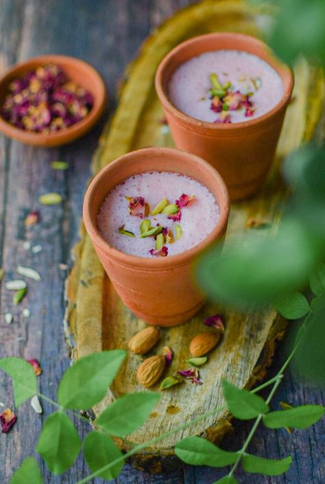 Rose lassi served in earthen tumblers on a wooden tray Rose Lassi, Pink Lemonade Recipes, Lassi Recipe, Royal Recipe, Drinkable Yogurt, Rose Syrup, Lassi Recipes, Refreshing Drinks Recipes, Dairy Drinks