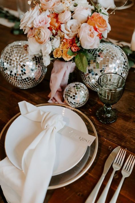 A classic white and gold place setting with colorful florals and fun disco details Disco Wedding Bridesmaids, Disco Ball Centerpiece Ideas Wedding, Bling Centerpiece Ideas, Disco Decorations Party, Wedding Decor Diy Ideas, Disco Ball Table Decor, Disco Balls Wedding, Trendy Wedding Decor, Canadian Decor