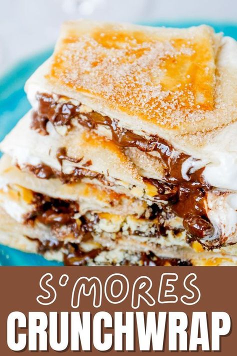 My s’mores Crunchwrap is one of my new favorite ways to devour a s’mores. Gooey marshmallows, melted chocolate, salty Ritz crackers all wrapped and stuffed in a warm grilled tortilla. This crunch wrap s’mores recipe is a game changer! Similar to a s’mores burrito but elevated even more. Smore Crunch Wrap, S’mores Crunch Wraps, Smores Crunchwrap Recipe, S’mores Crunchwrap, Blackstone Dessert Ideas, Blackstone Smores, Smores Crunchwrap, Blackstone Desserts, Blackstone Dessert Recipes