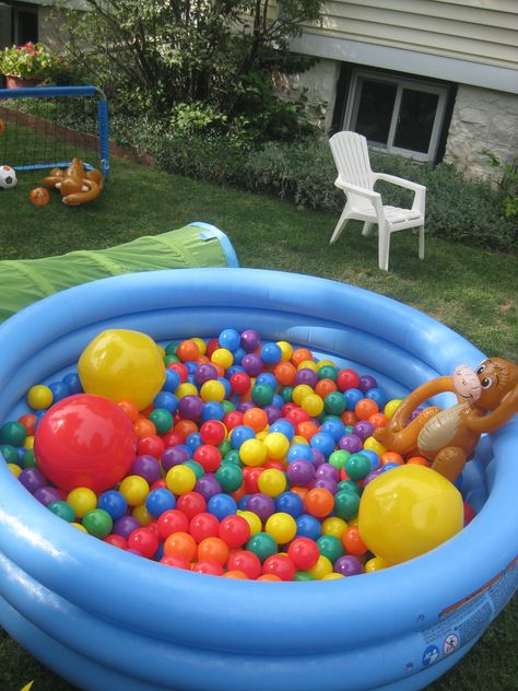 Need an easy activity for the kiddies? Fill your kid pool with plastic balls for a ball pit! Major hit with the toddlers! Kiddie Pool Ball Pit, Home Ball Pit Ideas, Ball Pit Birthday Party Ideas, Ball Pit Themed Birthday Party, Diy Outdoor Ball Pit, Inflatable Pool Ball Pit, Park Toddler Birthday Party, Toddler Pool Party Birthday, Toddler Pool Party