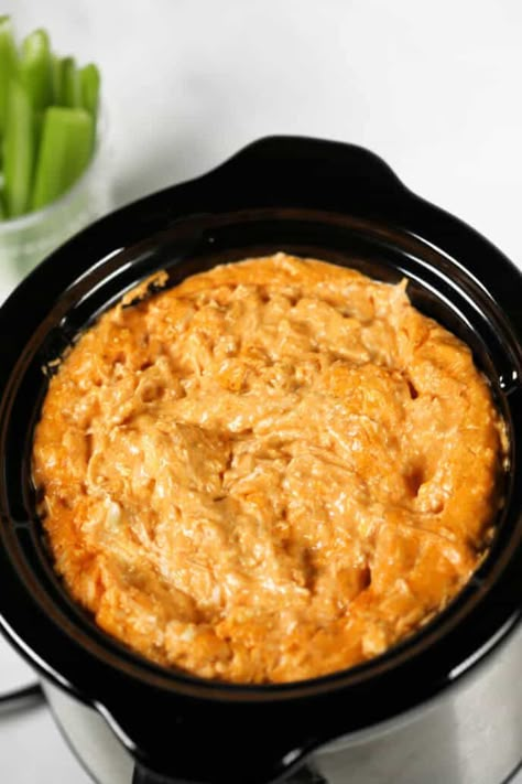 Need to feed a crowd but don't want to be stuck in the kitchen for your entire football gathering cooking wings? Try this fabulous Crock Pot Buffalo Chicken Dip. Crock Pot Buffalo Chicken Dip, Buffalo Chicken Dip Oven, Crock Pot Buffalo Chicken, Wing Dip, Chicken Wing Dip, Small Crock Pot, Buffalo Chicken Dip Crock Pot, Crockpot Buffalo Chicken, Buffalo Chicken Dip Easy