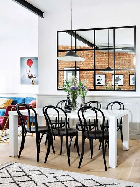 a large window with black frames that separates the dining room and kitchen and gives more light to both zones Window Pane Mirror, Industrial Mirrors, Mirror Dining Room, Classical Furniture, Decor Eclectic, Deco Studio, Interior Windows, Window Mirror, Ikea Hacks