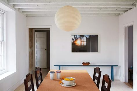 A neglected house becomes a home in the Hudson Valley - Curbed NY Orange Chest Of Drawers, Akari Pendant, Noguchi Lamp, Blue Side Table, Wassily Chair, Yellow Doors, Isamu Noguchi, Interior Stairs, Light Sculpture