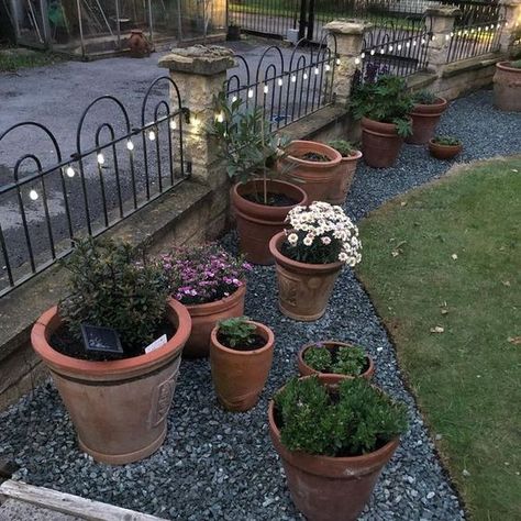 Potted Flower Bed, Flower Bed Ideas With Pots, Gravel Planter Bed, Rock Beds With Potted Plants, Gravel Flower Bed With Pots, Diy Rock Garden Ideas Flower Beds, Flower Pots In Garden Beds, Pea Gravel Flower Bed Ideas, Pots In Flower Beds