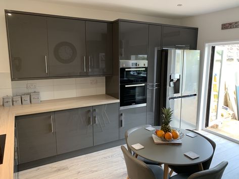 Grey Gloss kitchen with an American fridge freezer. With its filtered water and ice machine, this fridge is perfect on a hot summers afternoon. Kitchens With American Fridge Freezer, Kitchen American Fridge, Kitchen With American Fridge Freezer, American Fridge Freezer In Kitchen, Double Fridge And Freezer, Grey Gloss Kitchen, Kitchen Patio Doors, Cloakroom Ideas, Double Fridge