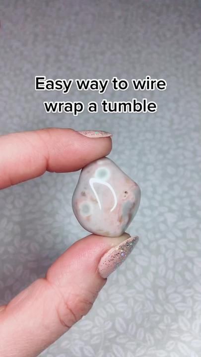 Easy way to wire wrap a tumble #jewelrybusiness #jewelrymaking #wirewr... | jewelry making | TikTok Crystals Tiktok, Wrapping Crystals, Diy Jewelry Making Tutorials, Wire Jewelry Rings, Wire Wrapped Stone Jewelry, Wire Wrapping Tutorial, Wire Wrap Jewelry Designs, Wire Wrapping Diy, Wire Wrapped Jewelry Diy