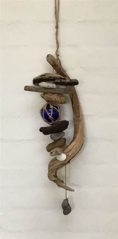 an angel made out of twigs hanging on the wall Drift Wood Dream Catcher, Driftwood Shell Art, Drift Wood Ideas Driftwood Art Diy, Driftwood Wind Chime Diy, Driftwood Crafts Wall Hangings, Driftwood Projects Unique, Driftwood Crafts Diy, Driftwood Chimes, Drift Wood Art